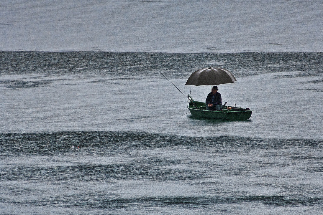 fishing_in_the_rain_by_andrewpoison